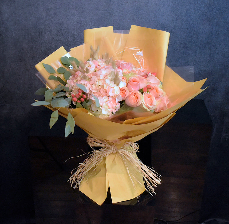 Bouquet of hydrangea and peach roses