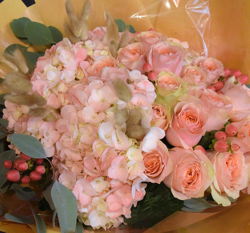 Bouquet of hydrangea and peach roses