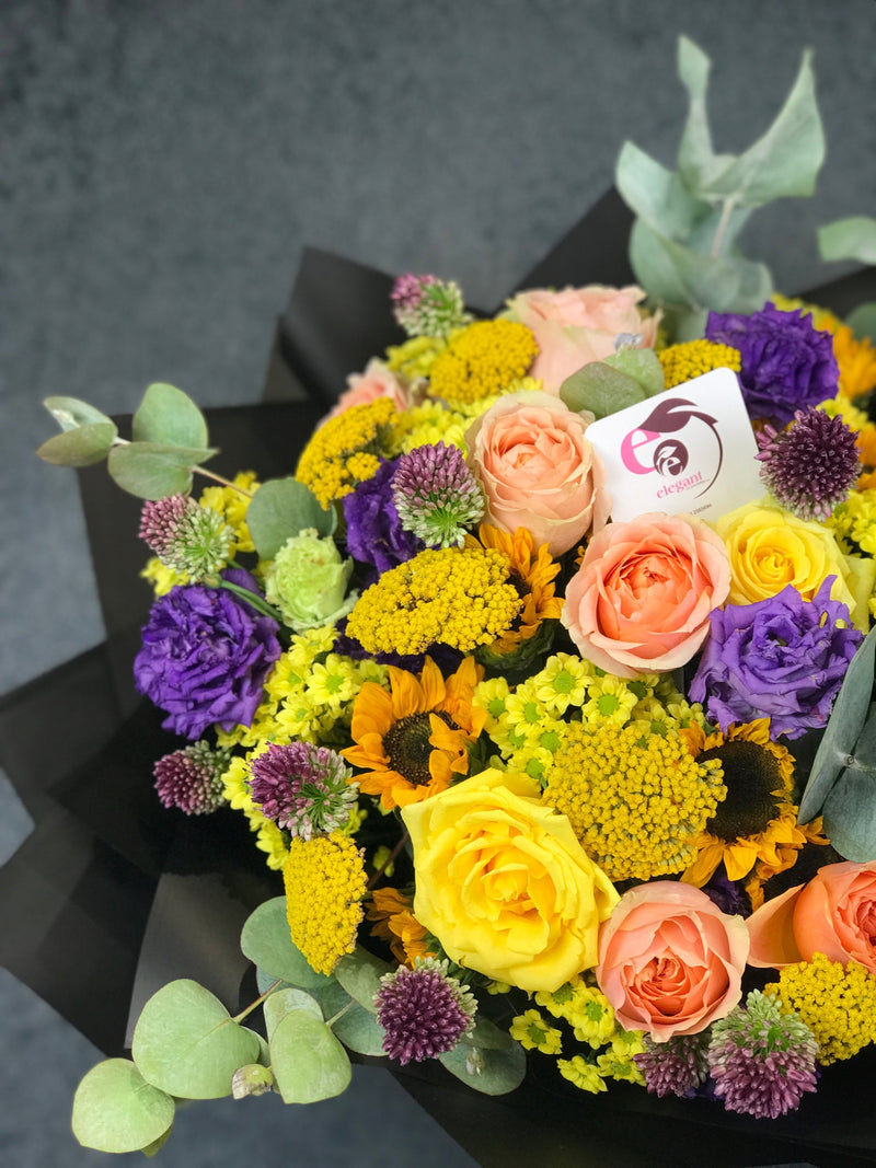 Bouquet of mix roses and sun flowers