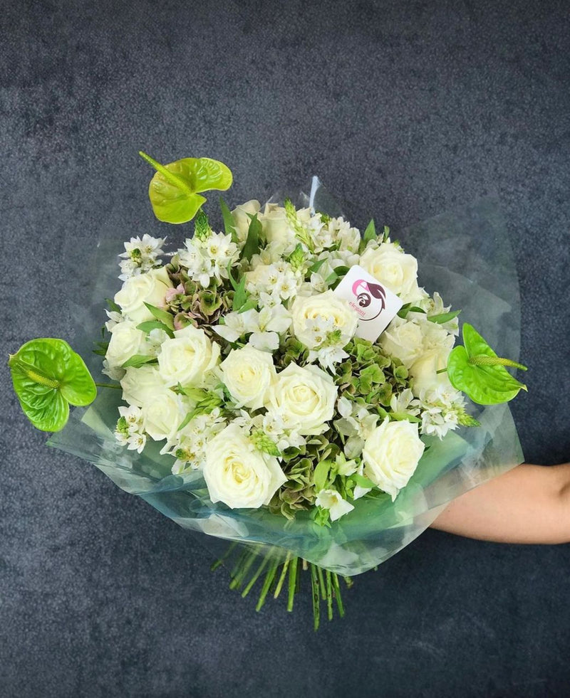 Bouquet of white roses with touch of green