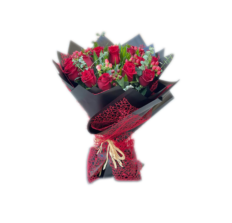 Bouquet of red roses with accessories wrapped in black and red