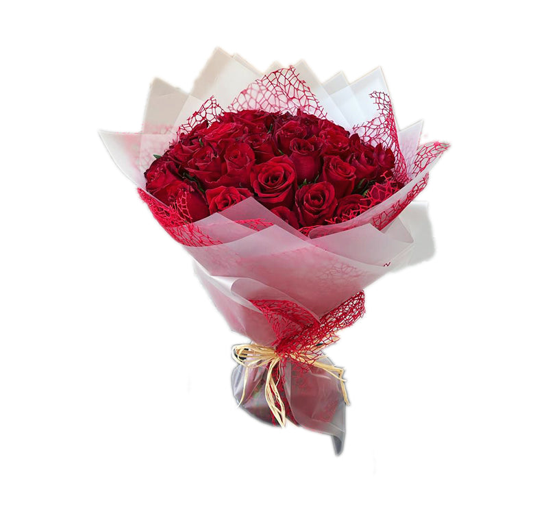 Bouquet of red roses wrapped in white and red